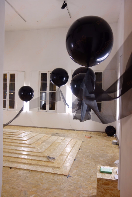 inside a single balloon at the entrance of the gallery - plywood