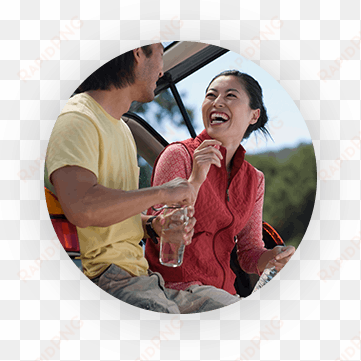 man and woman laughing and leaning against their suv - quest diagnostics publicidad