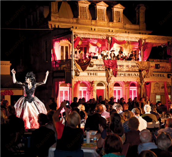 people watching a performer in a big dress with an - decoration