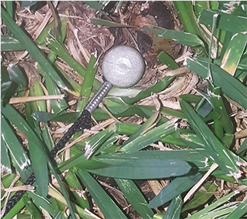 spike in the ground headstone - artificial turf