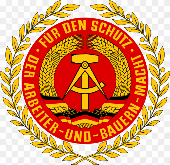 the official emblem of the east german national volksarmee - east german coat of arms